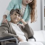 Senior supported by nurse